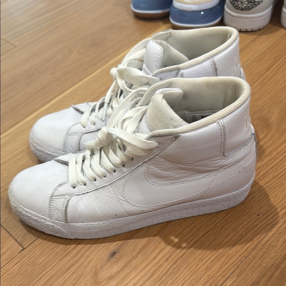 All white Nike blazers